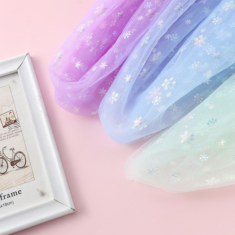 幻彩烫金厂七彩雪花玩具娃娃烫金闪亮网纱布料印金网布烫金网纱布