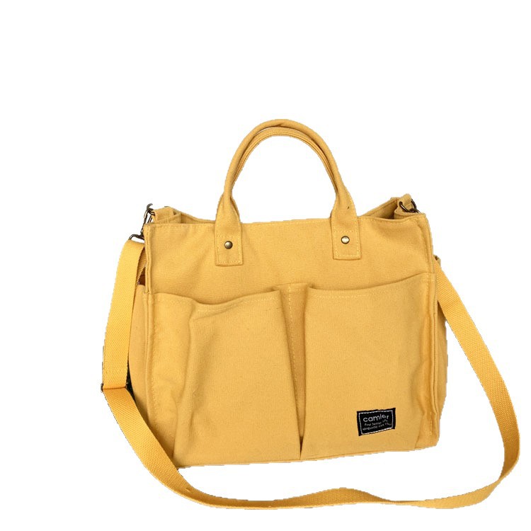 Nuevo estilo japonés bolsa de lona bolsa de mensajero de las mujeres de moda simple bolsa de tela estudiante bolso de lona casual