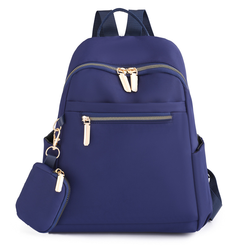 Comercio exterior al por mayor 2023 nueva mochila de nailon para mujer coreana, mochila de viaje al aire libre de todo fósforo de moda