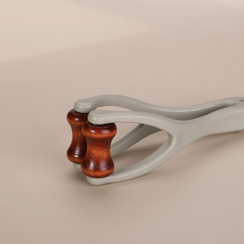 Bian Stone Finger Massage Tool Wooden Hand Joint Roller for Home Hand Care 20g in use