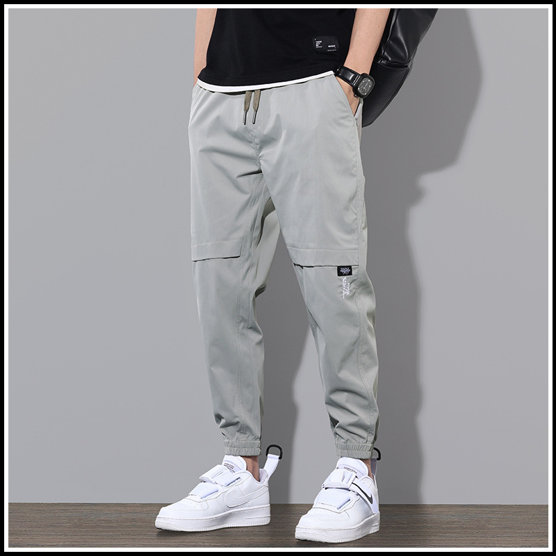Ropa de trabajo de primavera y otoño pantalones largos pantalones casuales de los hombres pantalones sueltos atados al tobillo marca de moda de primavera y verano Pantalones deportivos delgados