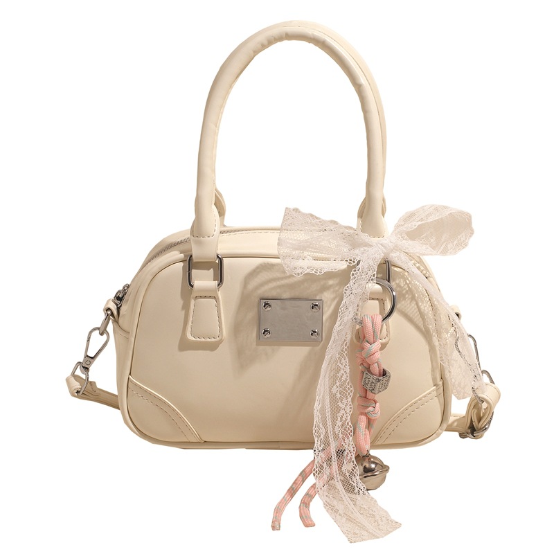 Bolsa de bolos portátil coreana de nicho para mujeres 2026 nueva textura mochila de hombro de estilo extranjero para viajar simple