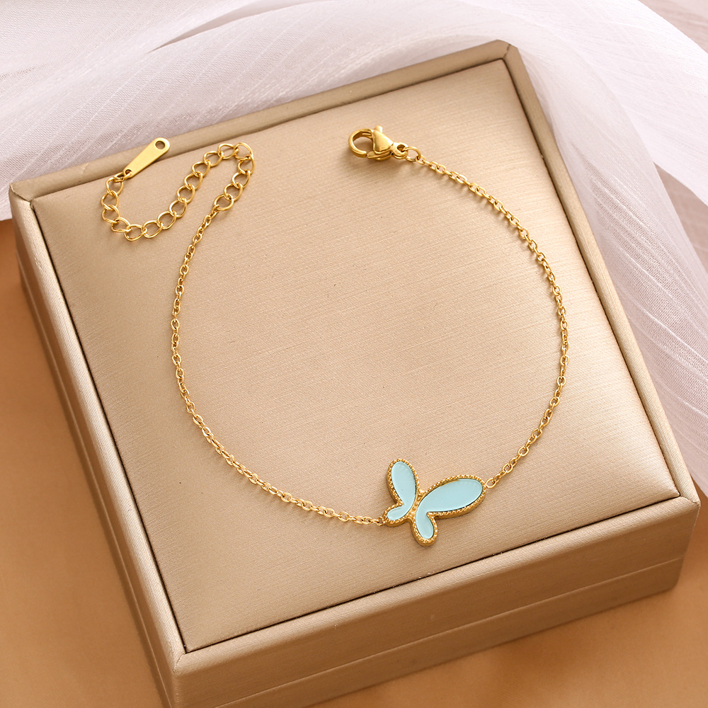 Pulsera de trébol de acero titanium vendedora caliente transfronteriza europea y americana con incrustaciones de concha pulsera colgante pulsera de diseño avanzado sin desvanecimiento al por mayor