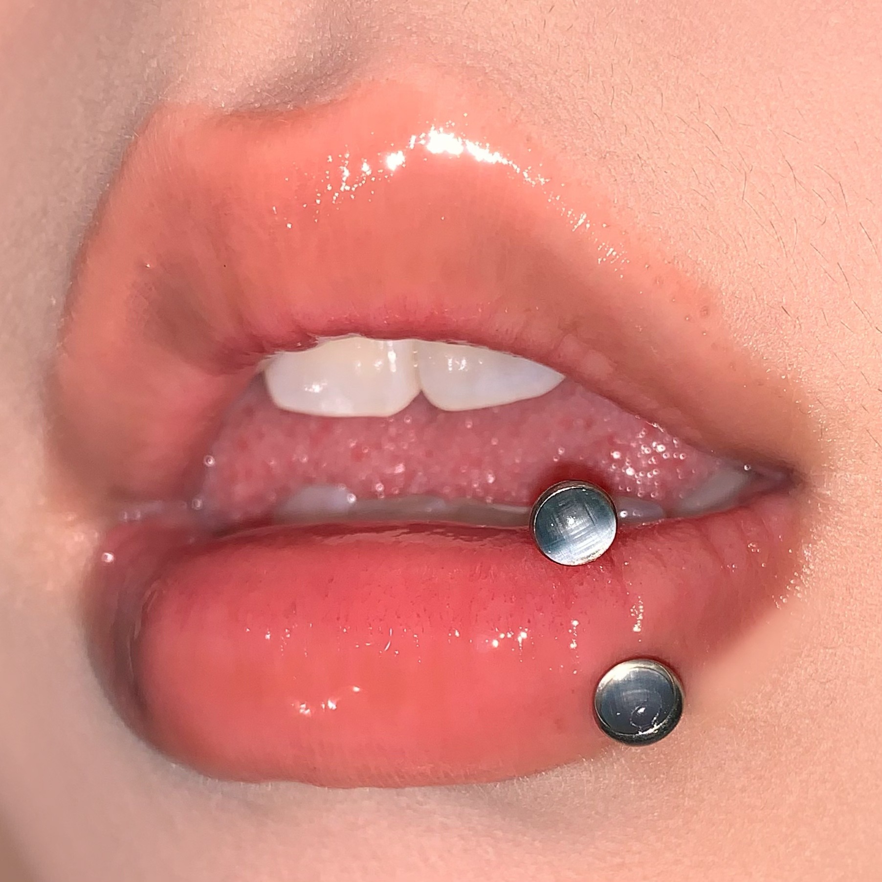 Silver pointed spike labret stud material detail