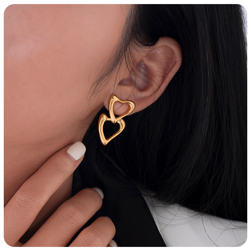 TENA nicho de amor amor amor hueco pendientes de acero inoxidable chapado en oro 18 quilates doble goteo de zircón pendientes de aceite