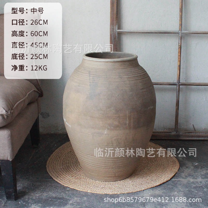 Botella de cerámica de tierra mediana