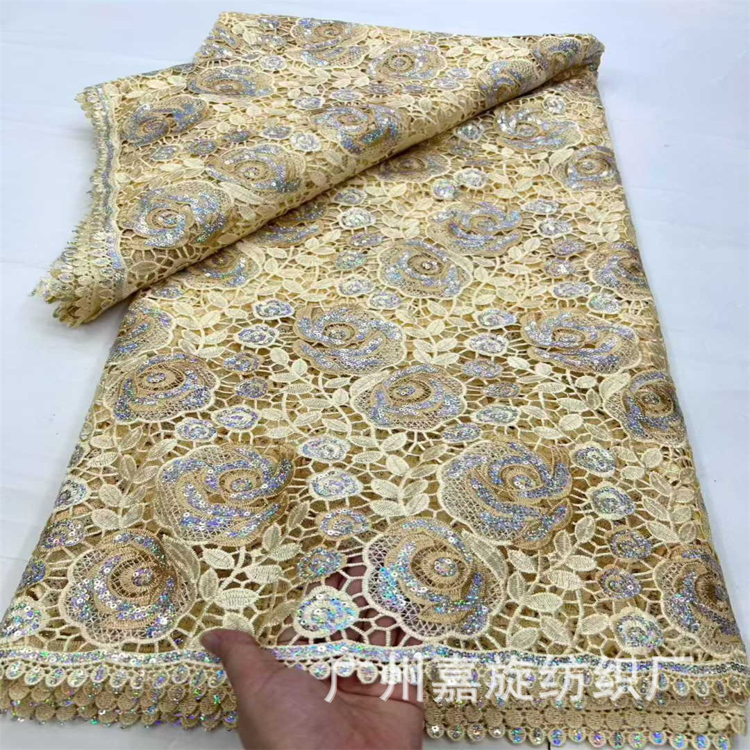 Tela de encaje africana con bordado láser de rosas huecas soluble en agua, en stock, para vestidos de moda.