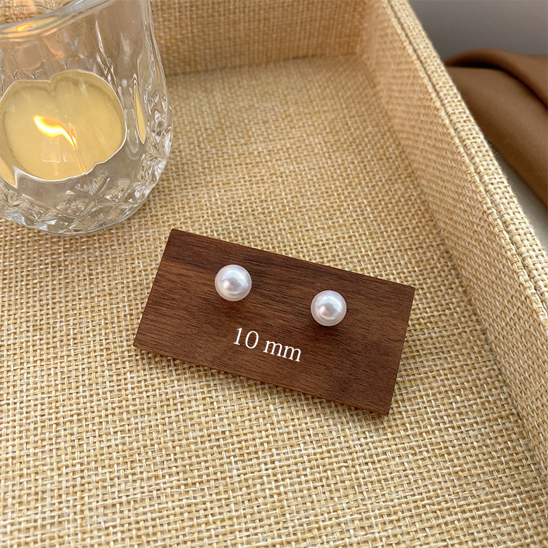 Pendientes de aro lisos para mujer, lujo ligero, pendientes de alta gama, pendientes populares, aretes de diseño exclusivo, aretes de otoño e invierno al por mayor