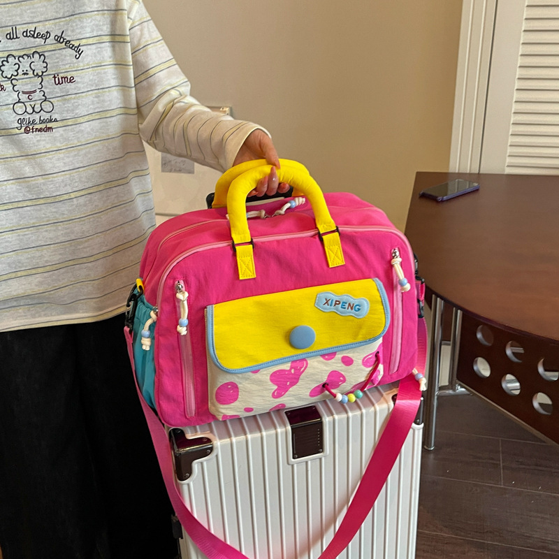 New Fashionable Color-Blocked Short-Trip Travel Bag, Lightweight Carry-On Bag for Business Trips, Can Be Attached to a Trolley, Suitable for Boarding, Accommodation, and Gym Use New Fashionable Color-Blocked Short-Trip Travel Bag, Lightweight Carry-On Bag for Business Trips, Can Be Attached to a Trolley, Suitable for Boarding, Accommodation, and Gym Use
