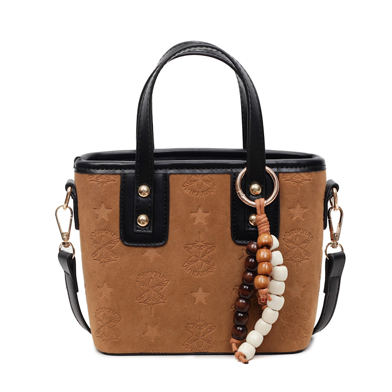 Popularidad transfronteriza retro bolso de cubo portátil para mujeres otoño / invierno 2025 nueva moda versátil bolso de hombro simple mochila