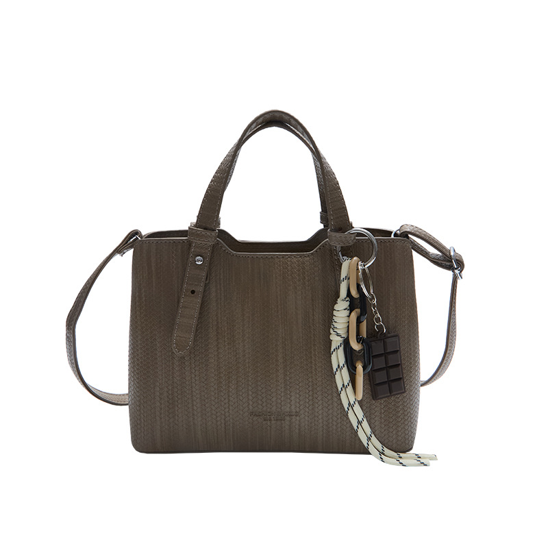 Texturas casuales bolsas de mano para mujeres otoño y invierno 2025 nueva moda simple bolsas de hombro versátiles retro mochila