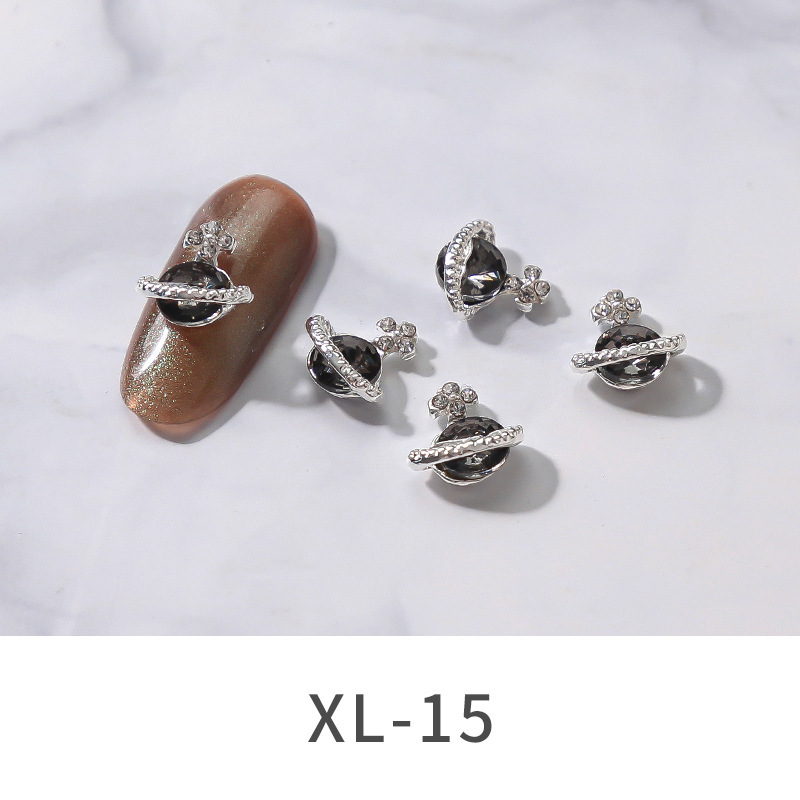 2021 Nueva joyería de Planeta de aleación de uñas popular transfronteriza brillante multicolor Luz de lujo incrustado en diamante uñas decoración de cielo estrellado