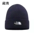 B navy blue knitted hat