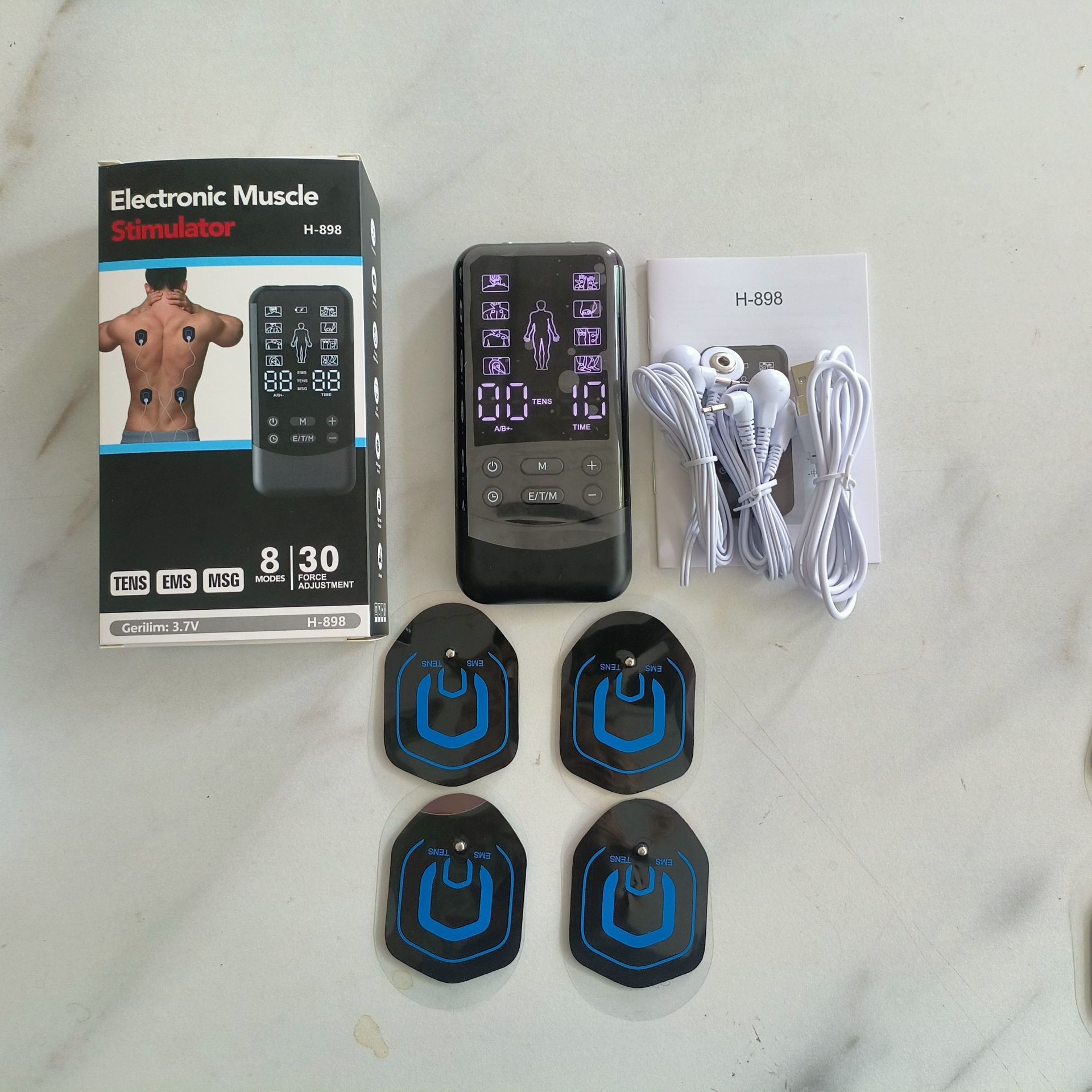 Host * 1 + un cable de dos botones * 2 + 4 piezas de parche (2 pares) + cable de carga USB + caja de color + instrucciones de idiomas de ocho países