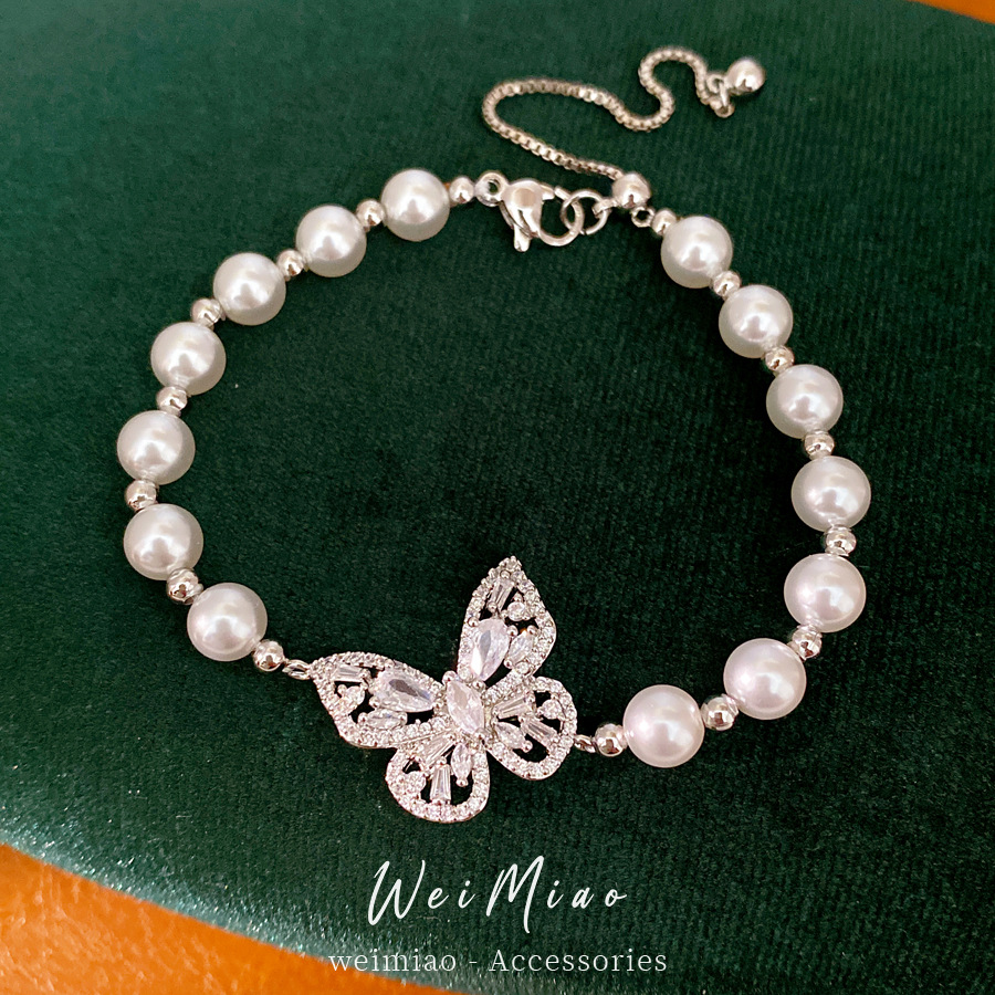 Brazalete de perlas mariposa con cuentas de diamante ligero lujo nicho pulsera de alta sensación temperamento exquisito joyería diaria universal