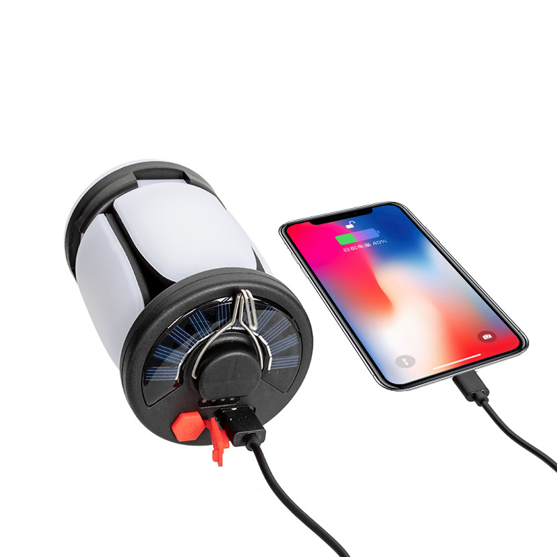 Transfronterizo nueva carga solar al aire libre camping luz con entrada de salida fuerte luz colgante lámpara de iluminación plegable