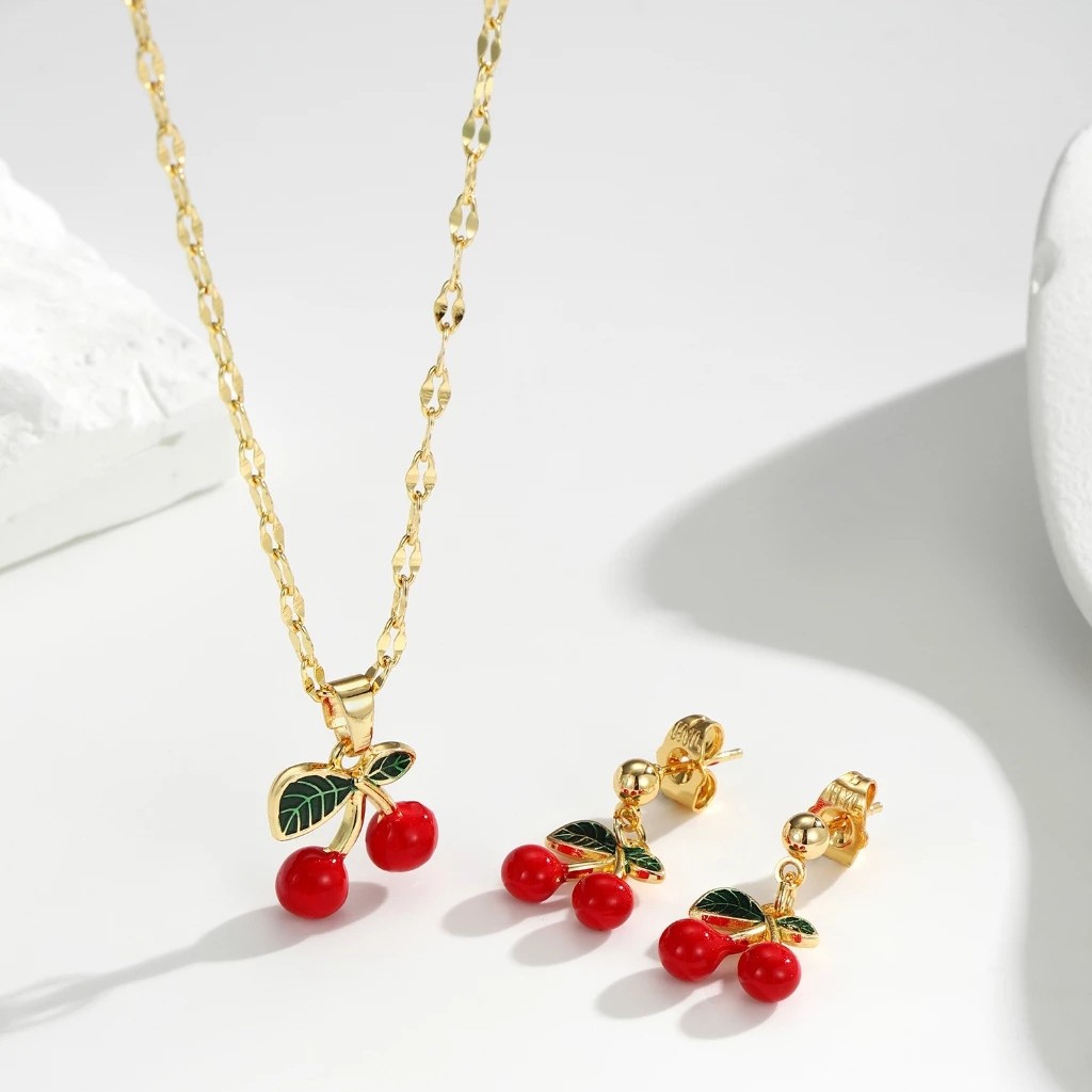 Explosiones transfronterizas coloridas cereza roja pintada a mano goteo de frutas series de joyería simple colgante de viento conjunto de aretes collar