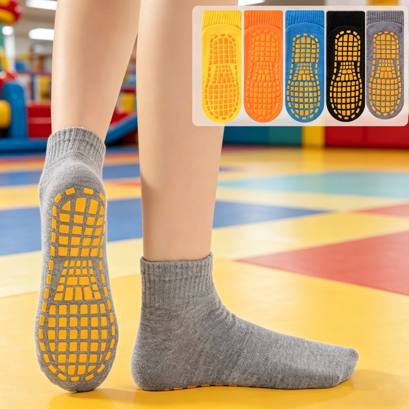 Colorful silicone non-slip cotton socks available for wholesale. Mid-tube anti-slip floor socks with silicone dots for early education centers and playgrounds