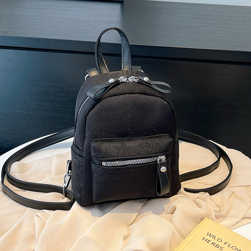 Mochila de chicas de moda de este año 2024 nuevo estilo de verano mochila de textura de moda universal viaje de viaje