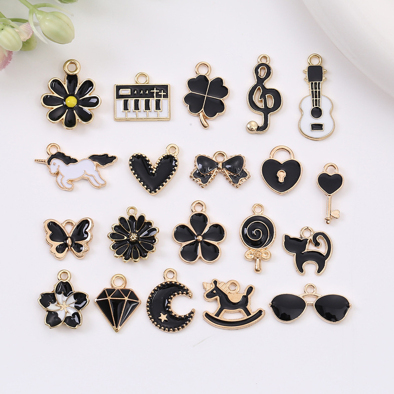 Wholesale Oil Dripping Alloy Black Series Pendant Musical Note Rocking Horse Mobile Phone Chain Pendant Creative DIY Jewelry Accessories