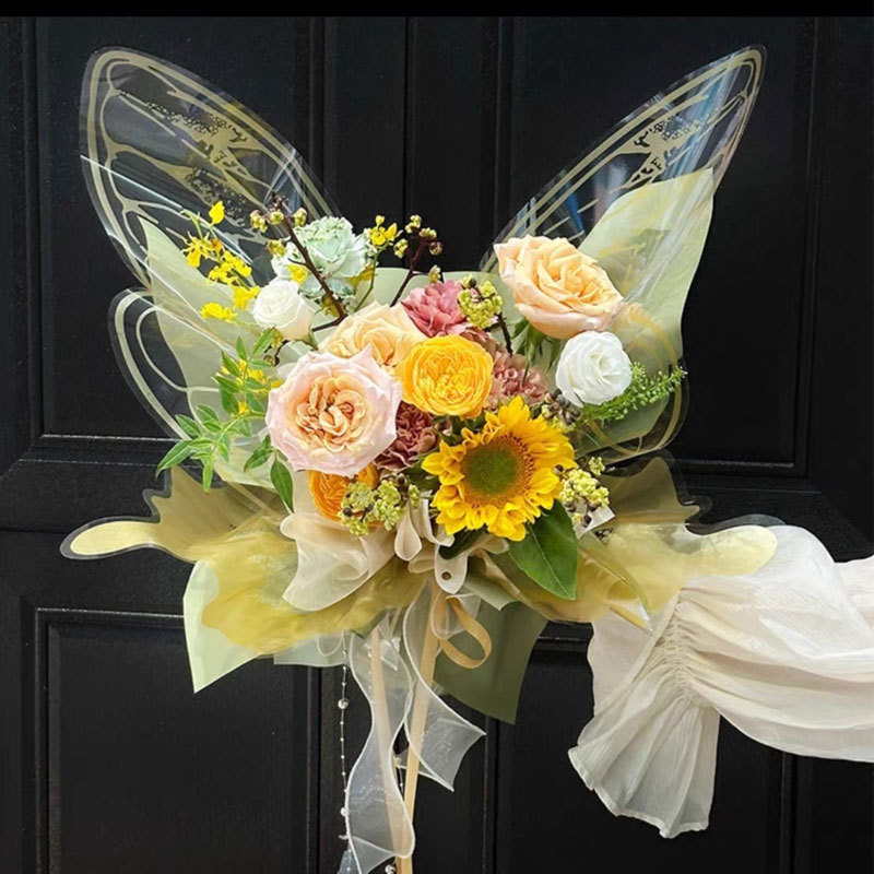 Fábrica de fiestas de flores de venta caliente creativo transfronterizo nuevo papel de embalaje de flores de mariposa transparente ramo de flores papel de embalaje