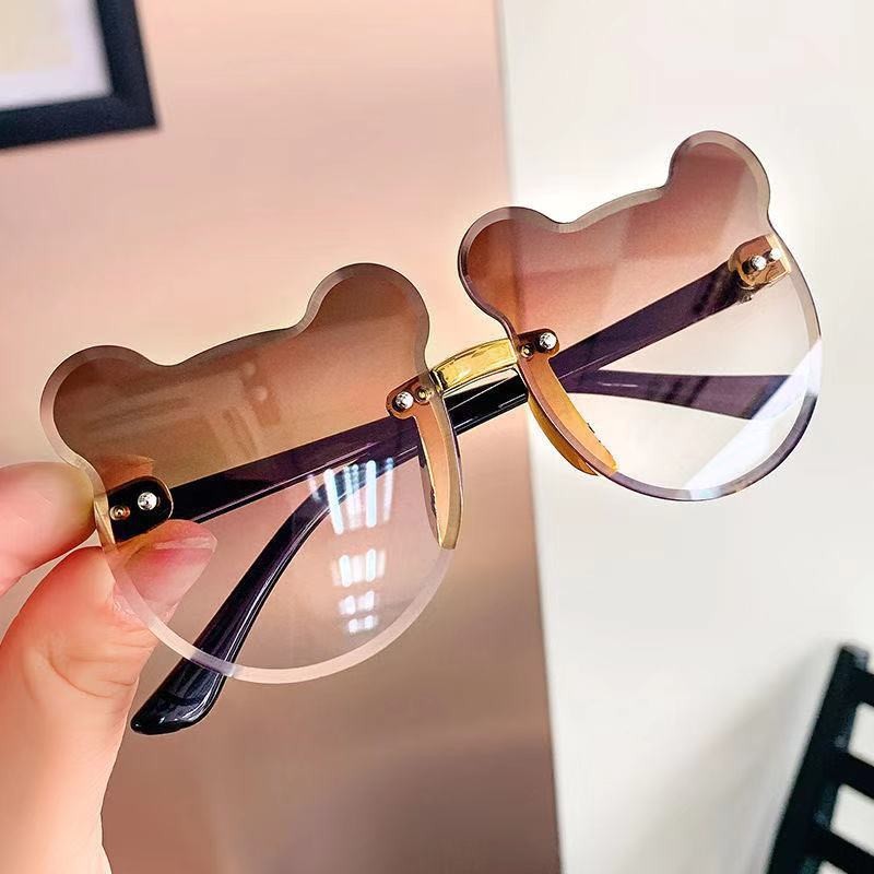 Nuevo oso gafas de sol de los niños raqueta de calle vanguardia moda calle raqueta copia pieza sin marco chica gafas de sol fábrica al por mayor
