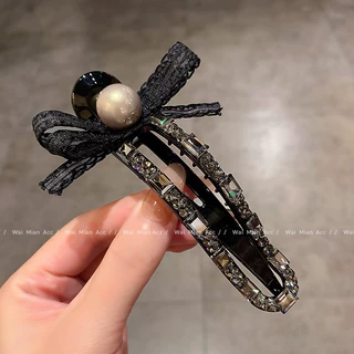 高端蝴蝶结黑色抓夹懒人夹女高级感镶钻后脑勺全盘发夹鸭嘴夹发饰