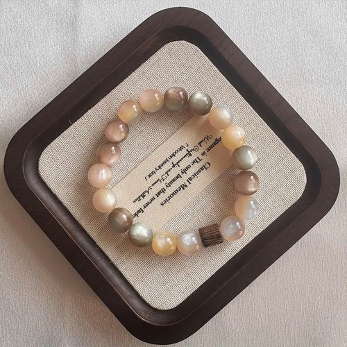 Sustainable-style, visually stunning Instagram-worthy, niche women's bracelet with a 2025 vintage pink-brown charm.