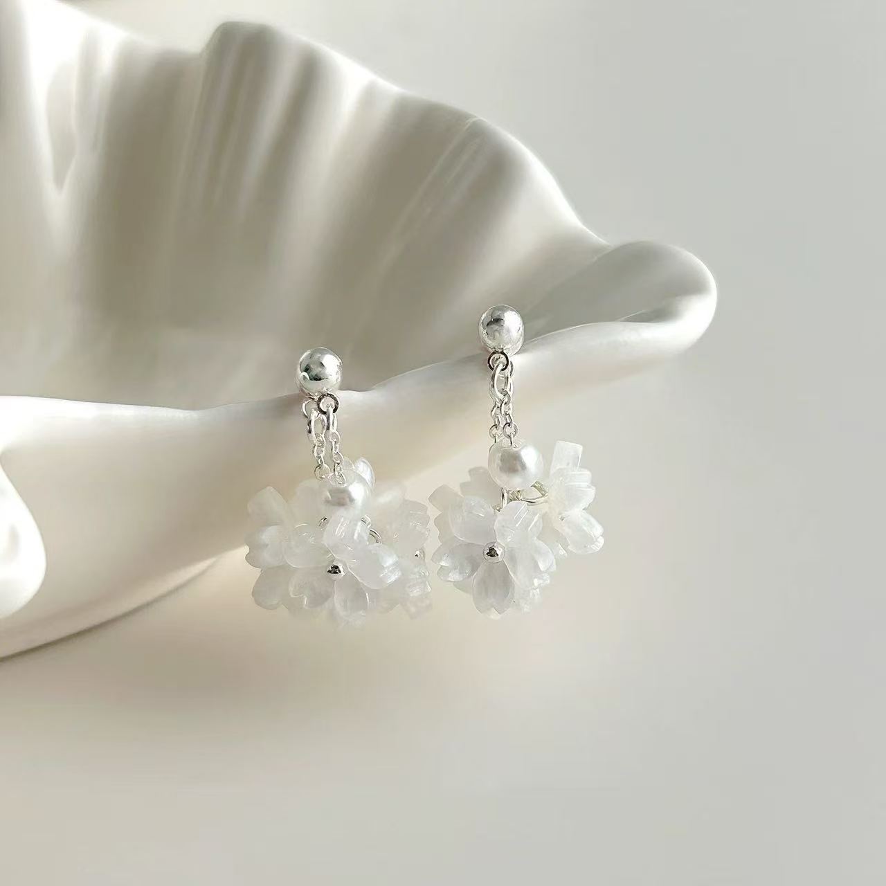 White earrings with tassels from pearl, flowered