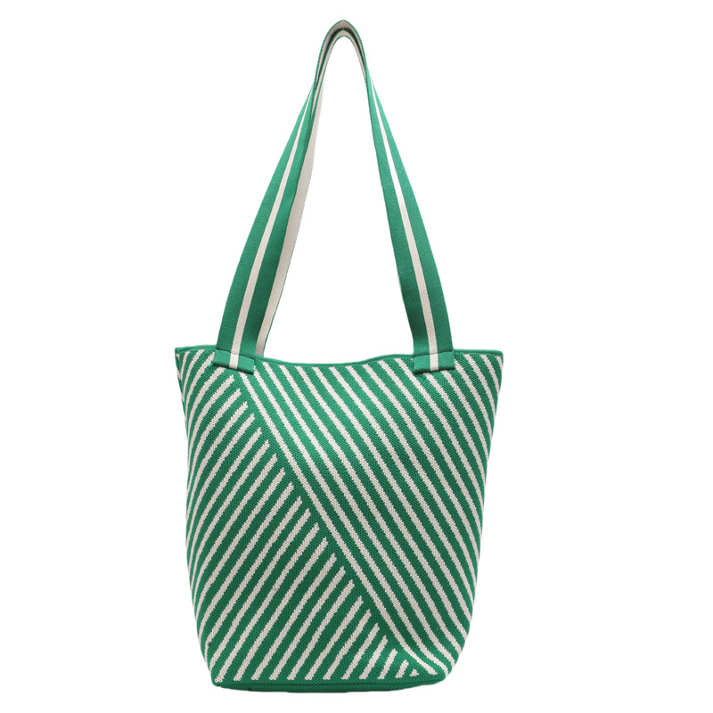 Knitted bags are fashionable and versatile. Knitted tote handbags are new large-capacity shopping bags for women. Single-shoulder bags are new for office workers undefined
