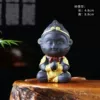 Black pottery red scarf pray for blessings