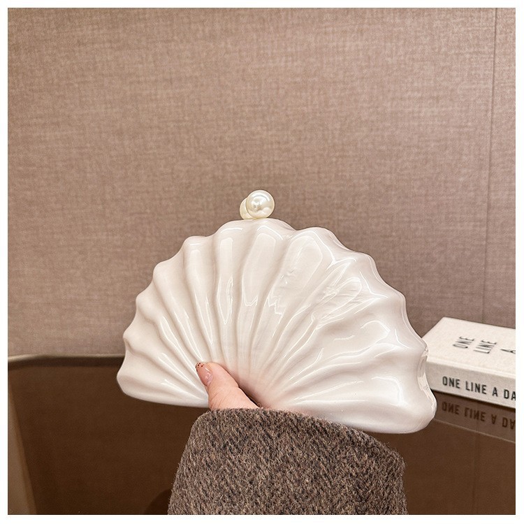 Europa y los Estados Unidos nuevos paquetes de cena de damas de hombro único en forma de concha acrílica de mano de lujo ligero paquete de moda de noche