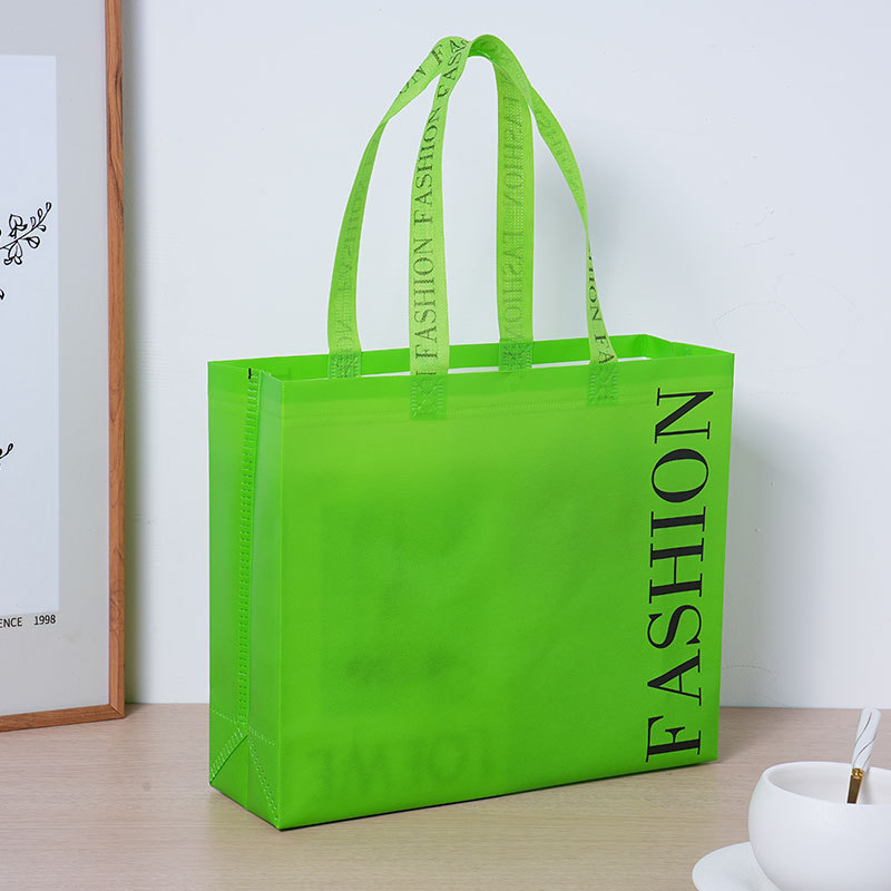 Bolsas de tela no tejida de película creativa espesa bolsa de ropa tienda de ropa bolsa de compras de mano ecológica bolsa de tela no tejida personalizada image 5