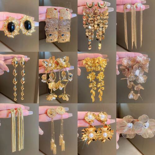 Silver needle flower bow metal tassel earrings European and American exaggerated luxury earrings niche creative new earrings for women