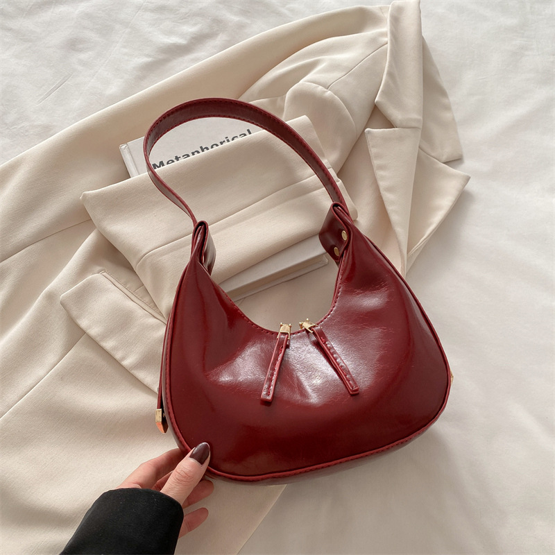 Estilo coreano ins 2025 primavera y verano nuevo diseño de nicho celebridades de Internet damas con un solo hombro y axilas albóndigas paquete de medio mes