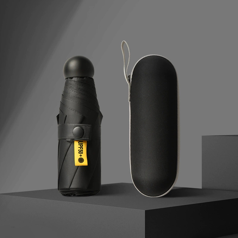 50% de descuento paraguas de cápsula de seis huesos paraguas de Sol de doble uso pequeño paraguas de bolsillo portátil simple pegamento negro paraguas de protección solar al por mayor