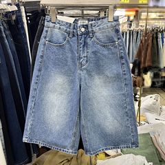 韓国の春の新型のレトロな百合は古い水洗いをして白いデニムの広い足のズボンを磨きます。