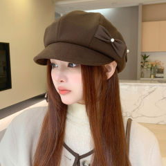カレー色のアヒルの舌のベレー帽の女性の秋冬の韓国版のファッションの百合のカジュアルな真珠の蝶結びの八角の帽子は顔が小さいです。