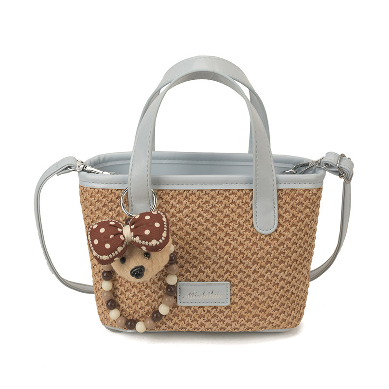 Bolsa de playa de moda coreana tejida, color extranjero, bolsa de hombro ligera y compacta para niños y niñas, nueva bolsa infantil transfronteriza.