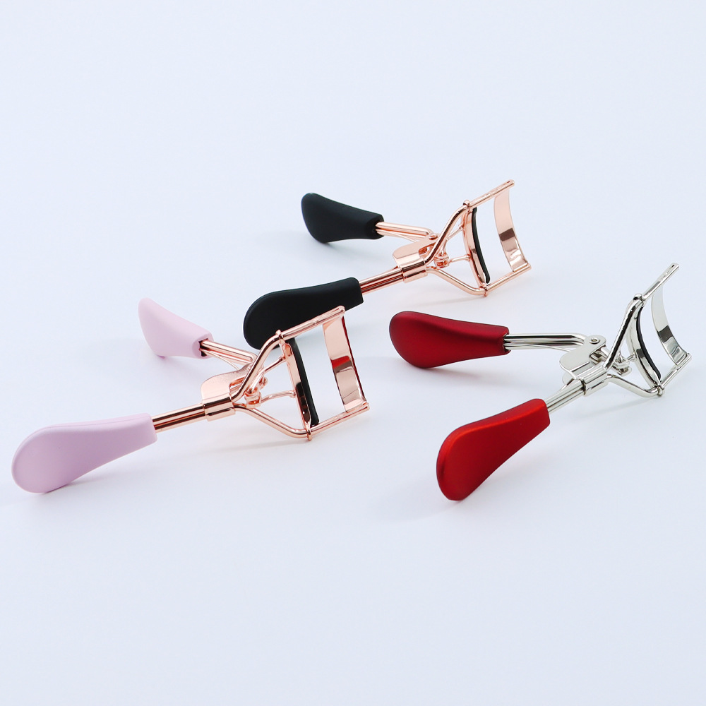 Golden curling eyelash curler contains rose