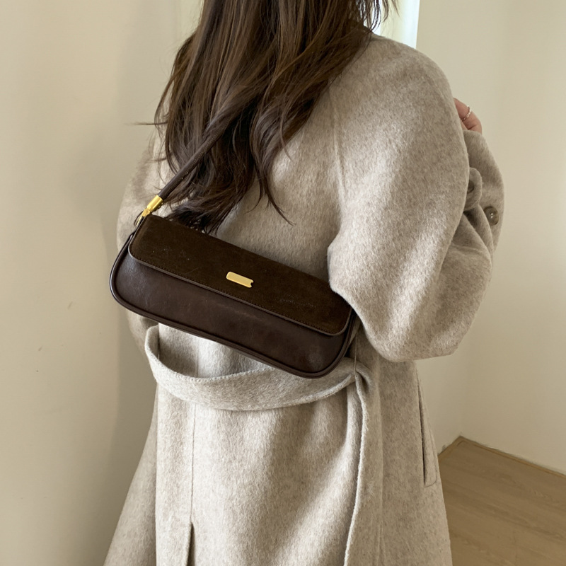 Bolsas de brazo retro de moda transfronteriza mujeres 2025 invierno nuevo estilo francés nicho bolsas de palo de moda bolsas de hombro casuales
