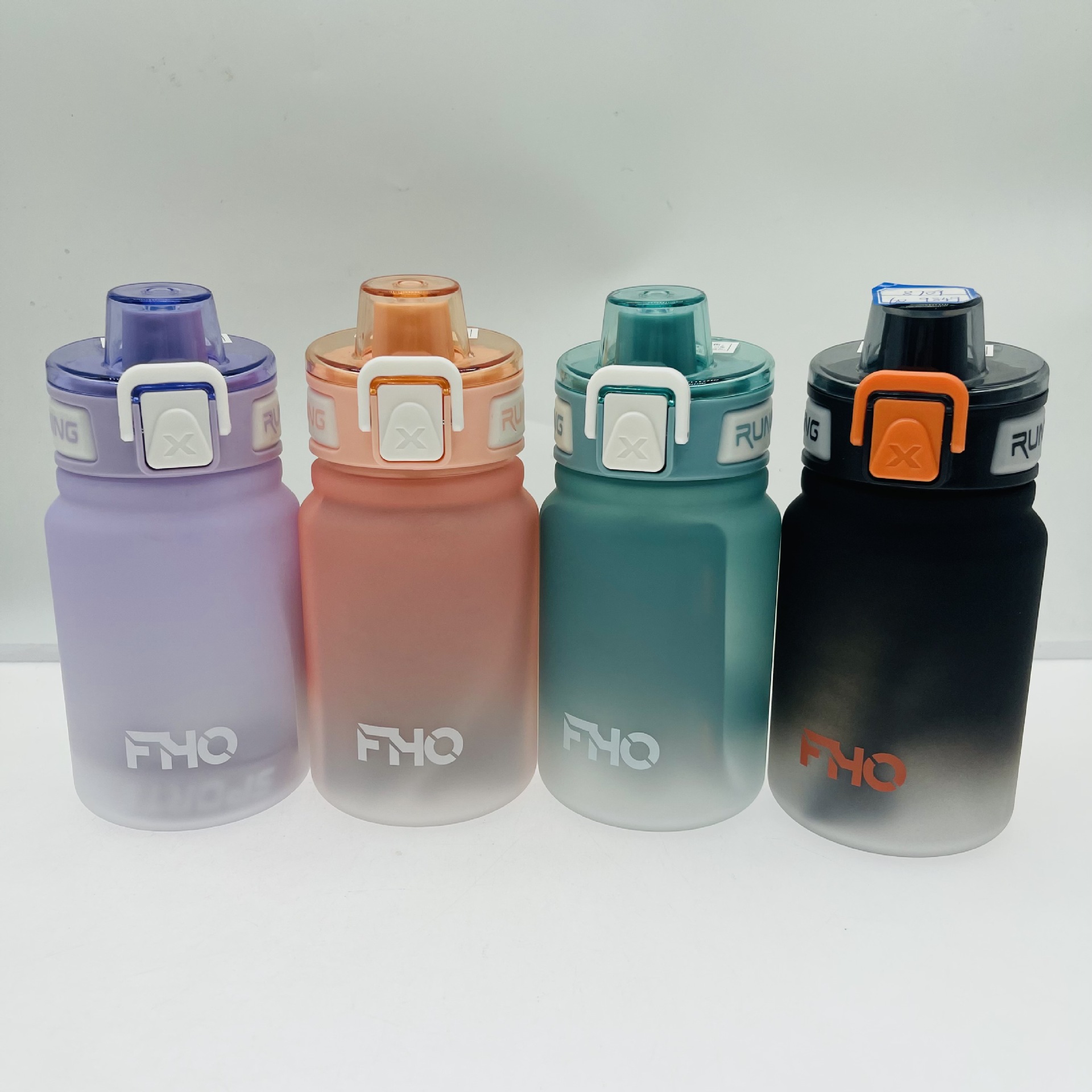 Yichang 8711 Comercio exterior gradiente plástico taza de agua 950ml gran capacidad deportes al aire libre mango espacio al por mayor