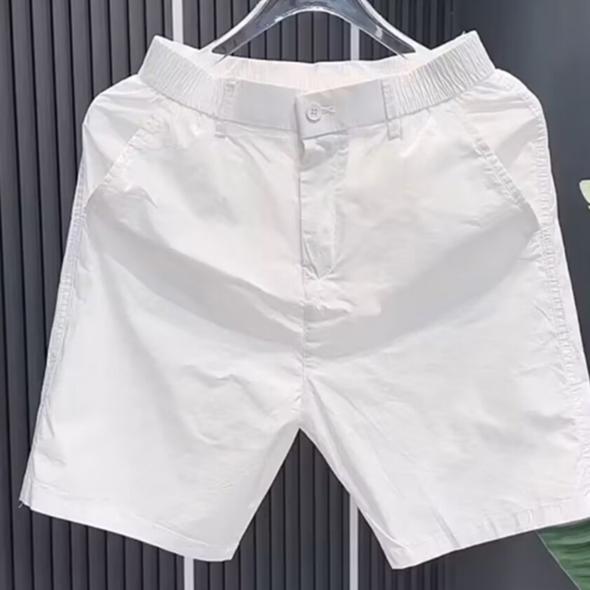 Pantalones cortos casuales negros puros para hombres, estilo fino de verano, tendencia, sentido de alta gama, deportes rectos, todo fósforo, pantalones de 5 puntos para hombres