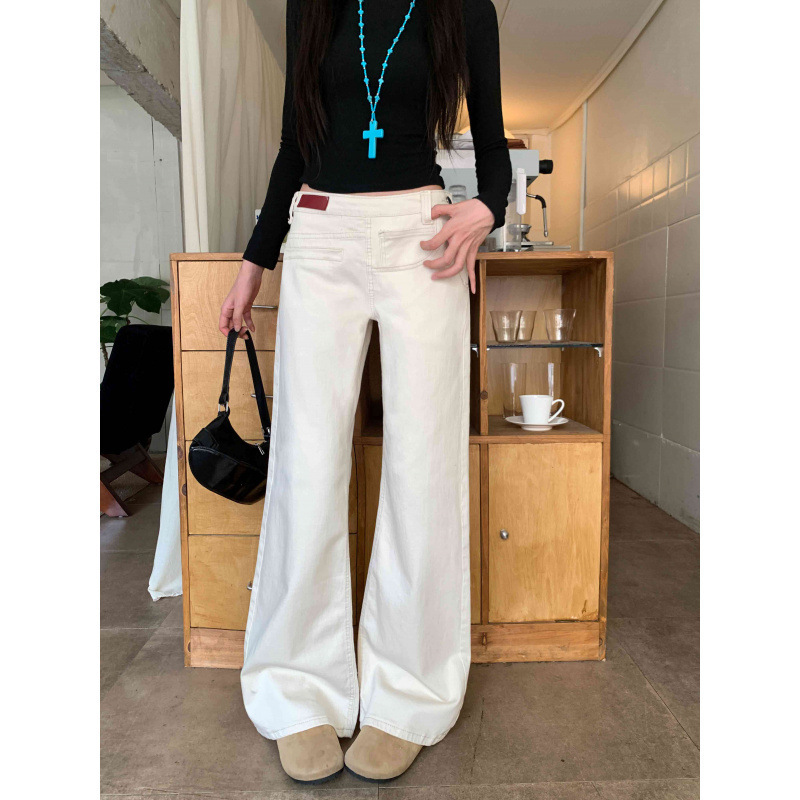Real shot of plus-size American-style washed distressed deconstructed asymmetrical women's jeans, loose straight-leg drapey wide-leg pants