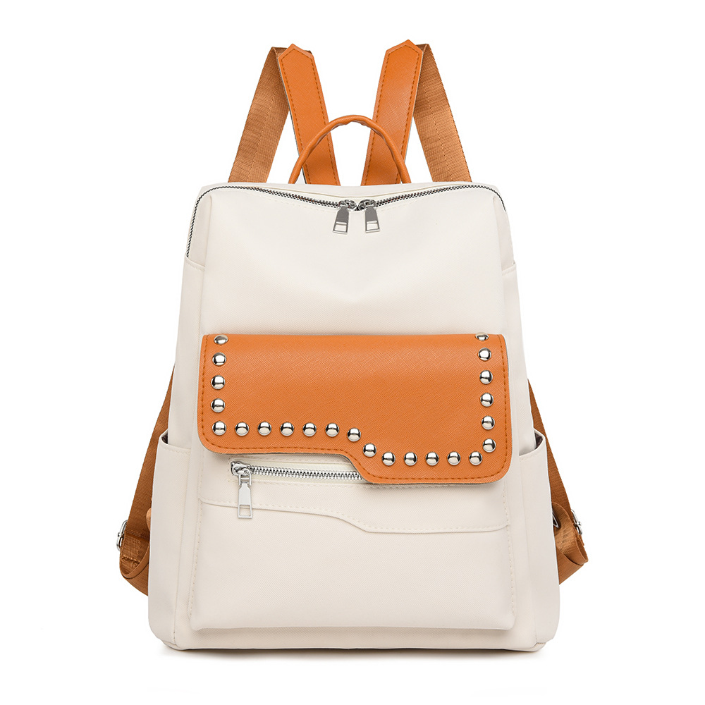 Nueva mochila con remaches para mujer de color en contraste, mochila de viaje simple y versátil de gran capacidad, mochila de viaje al aire libre, al por mayor