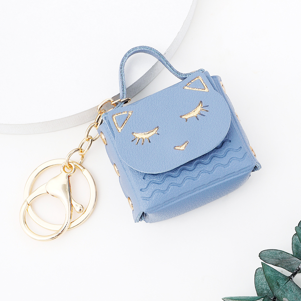 Ruoguo cuero gato cabeza monedero llavero moda coche bolsa pareja llavero pequeño colgante al por mayor