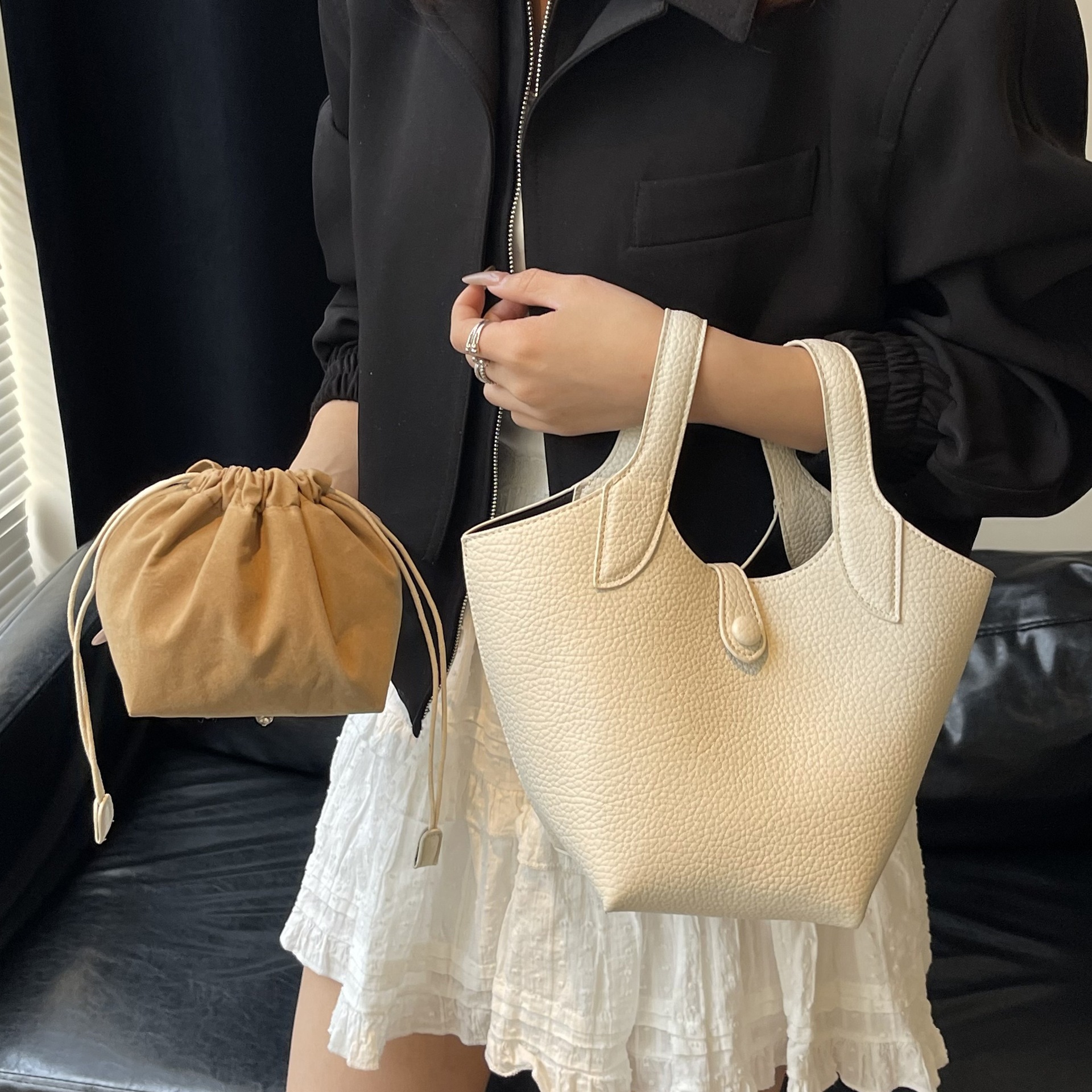 Bolsa de axila de textura de nicho Bolsa de mujer 2025 primavera nuevo bolso de cubo bolso de canasta de mensajero de un solo hombro simple