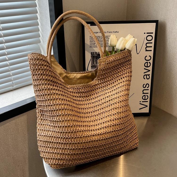 Verano simple y popular bolso de paja femenino 2025 nuevo estilo estilo occidental tejido bolso de playa bolso de viaje de gran capacidad