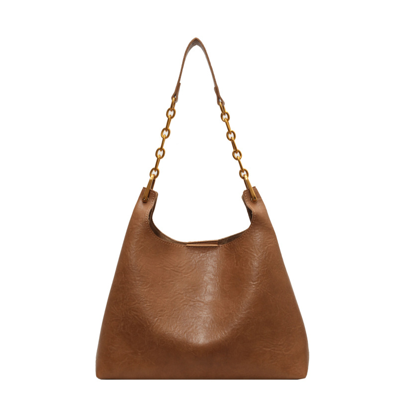 Bolsa de mano relajada coreana para mujeres 2025 nuevo retro versátil viaje bolso de hombro bolso de cubo debajo de la axila