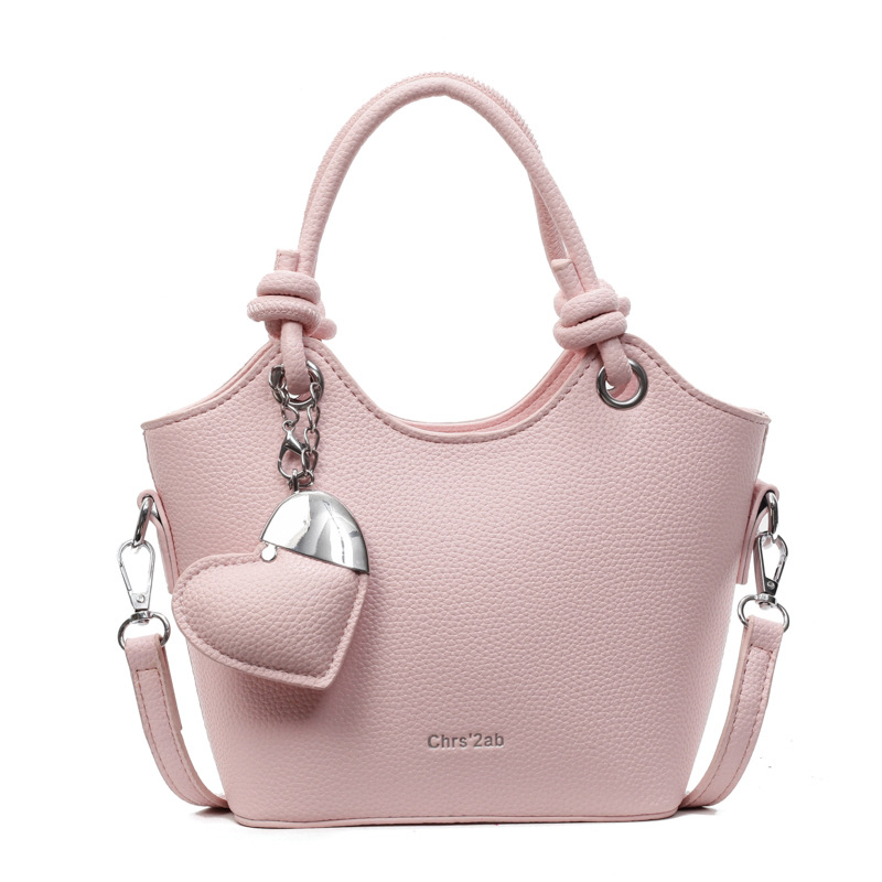 Moda de verano bolso de cubo de mano mujer 2025 nuevo producto diseño de nicho bolso de viaje bolso de mensajero casual simple